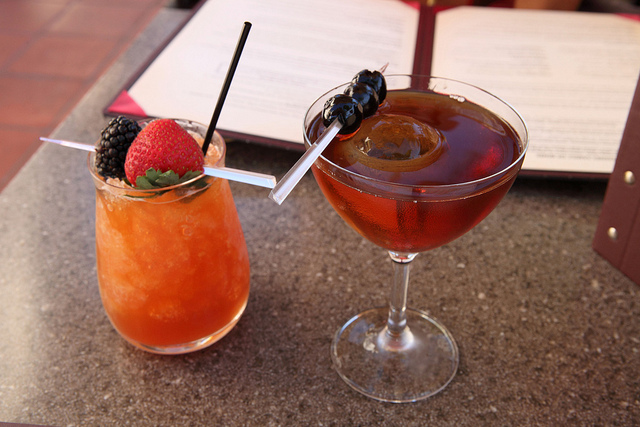 Cocktail drinks served on a tray.