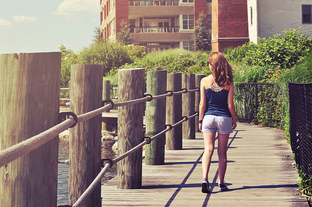 A person walking alone on a path.
