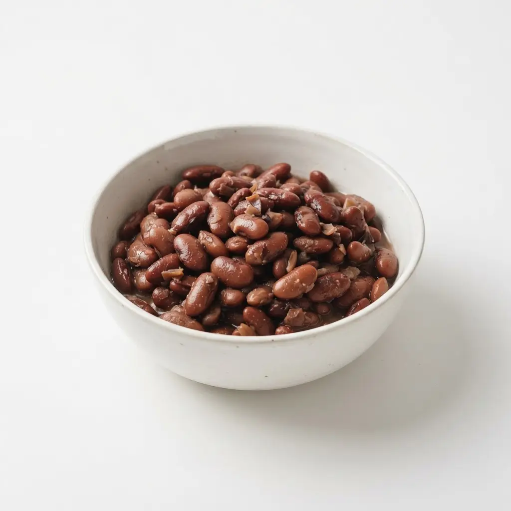 Beans in a plain white bowl on a clean white background.