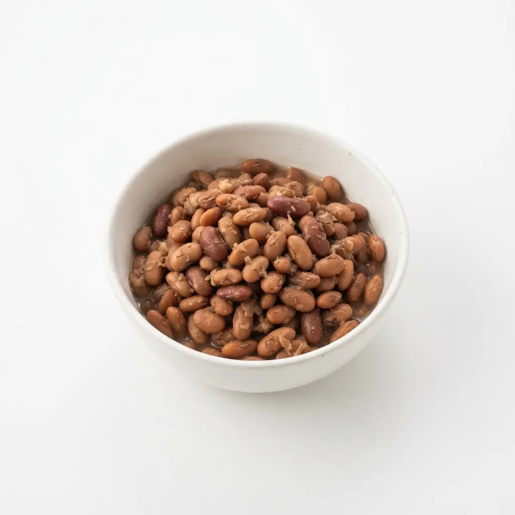 Beans in a plain white bowl on a clean white background.